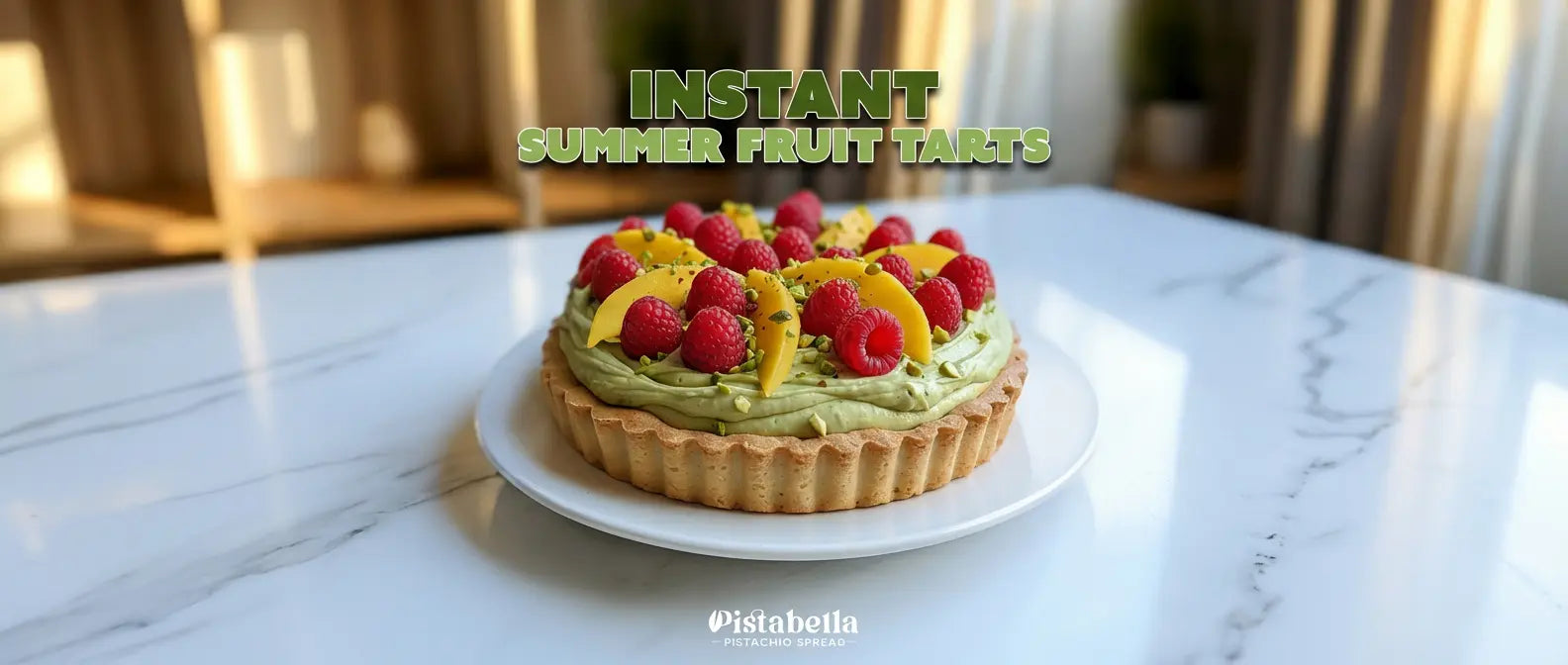 Pistachio tart with Pistabella spread base, raspberries, mango, and crushed pistachios on a marble surface.